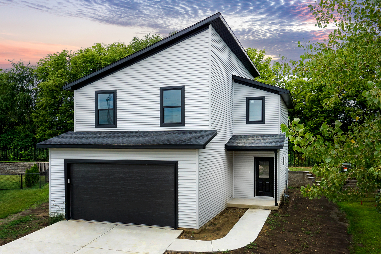 a front view of a house with yard