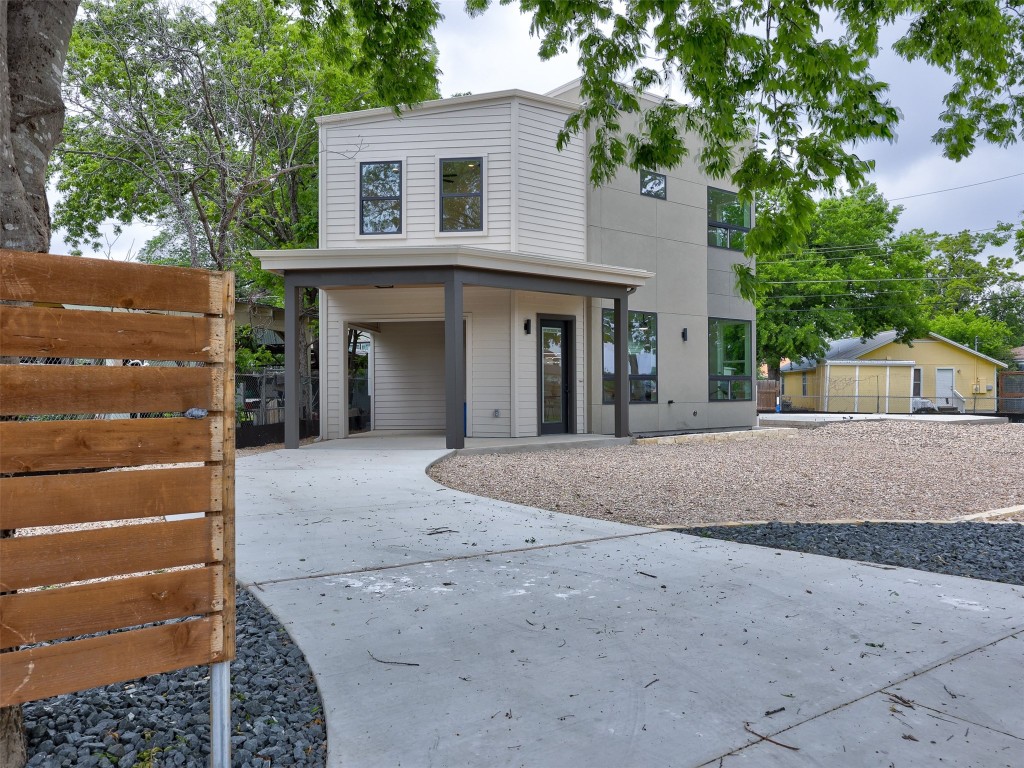 a view of a house with a yard and a garage