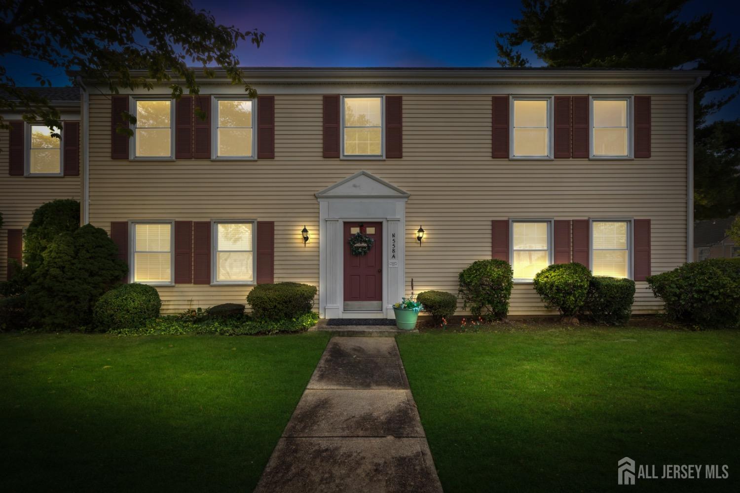 a front view of a house with a yard