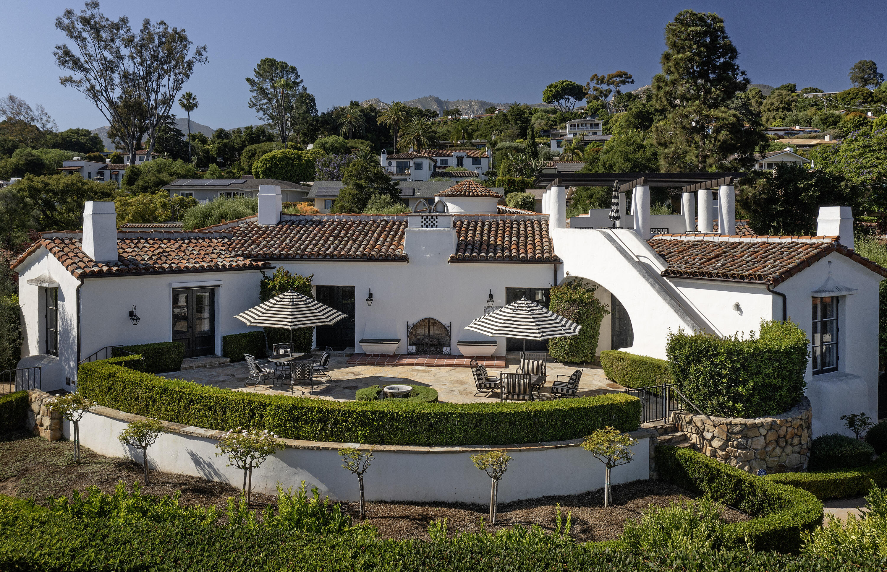 an aerial view of a house with garden swimming pool and outdoor seating