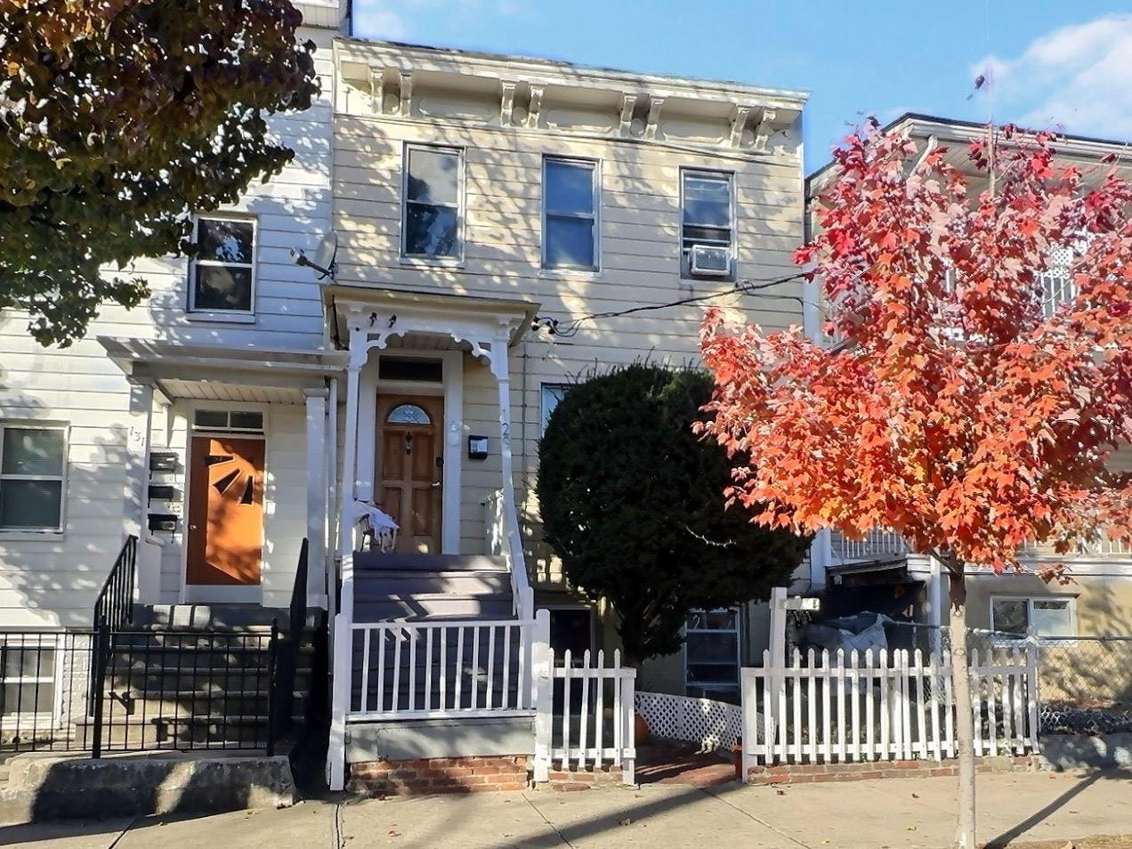 front view of a house with a street