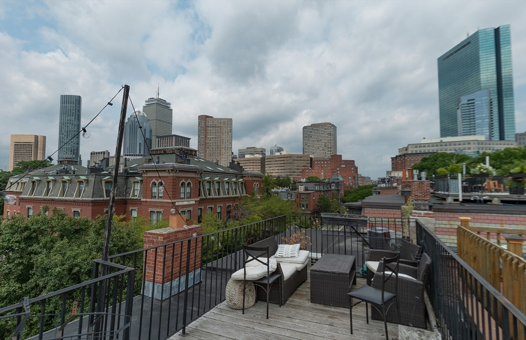 a view of a terrace with sitting area