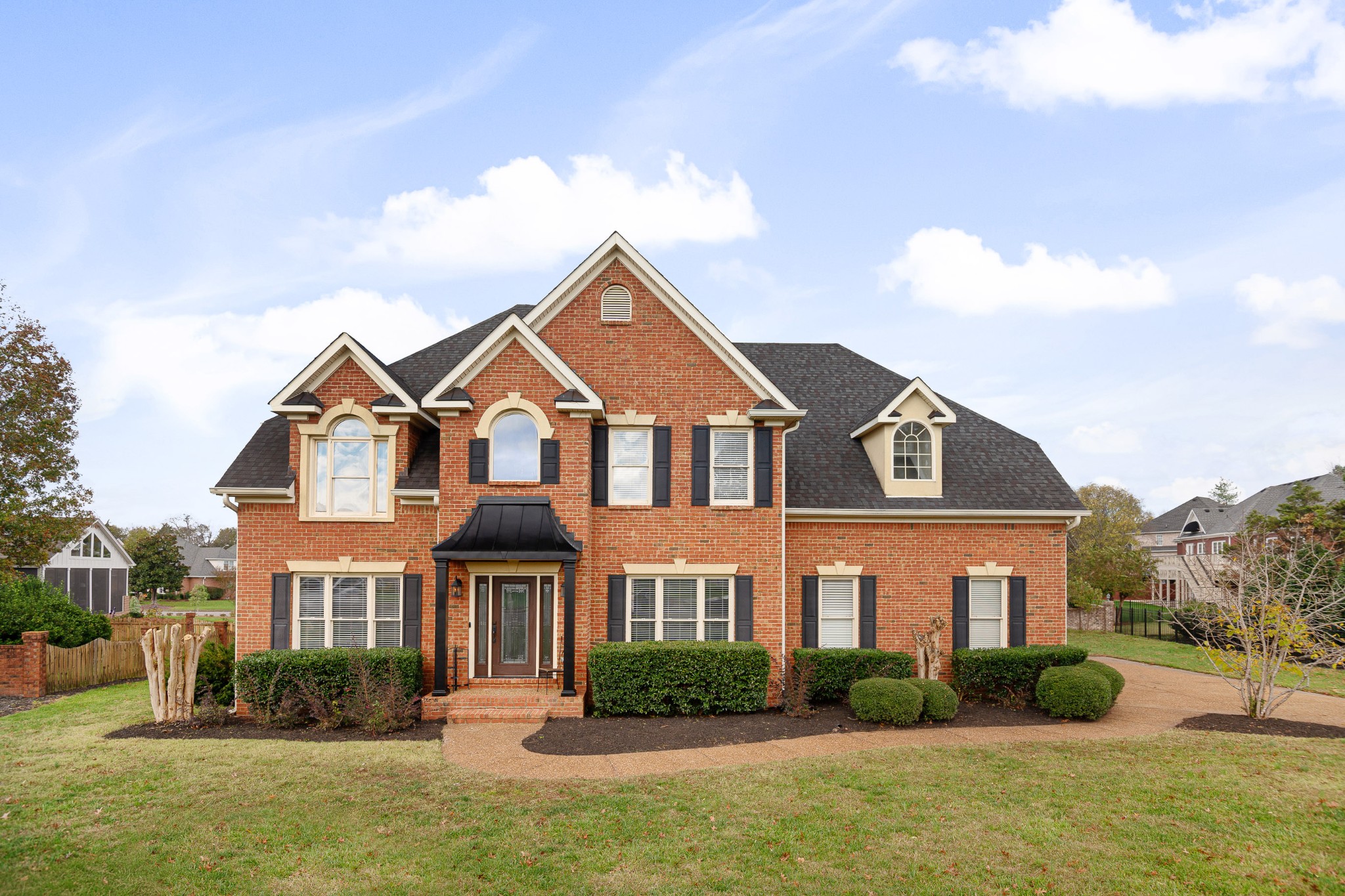 a front view of a house with a yard