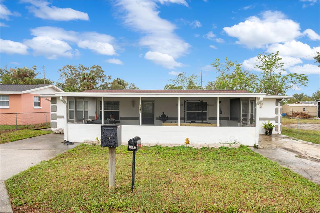 front view of a house with a yard