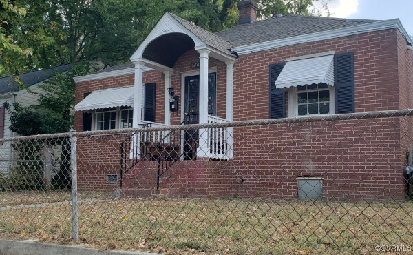 a front view of a house with garage