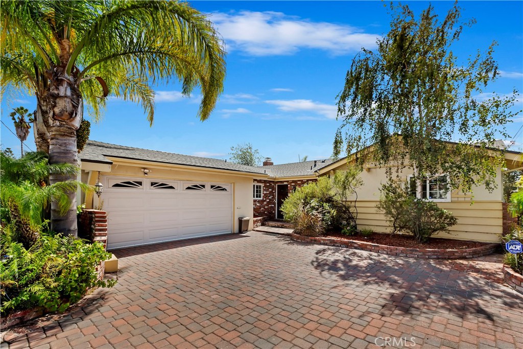 a view of a garage with a tree