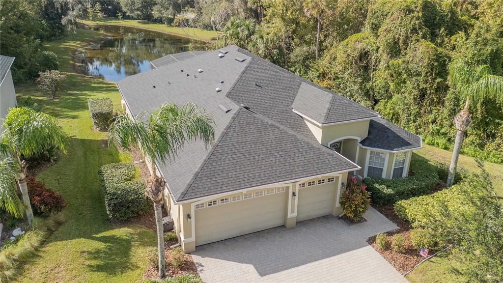 a aerial view of a house with a yard