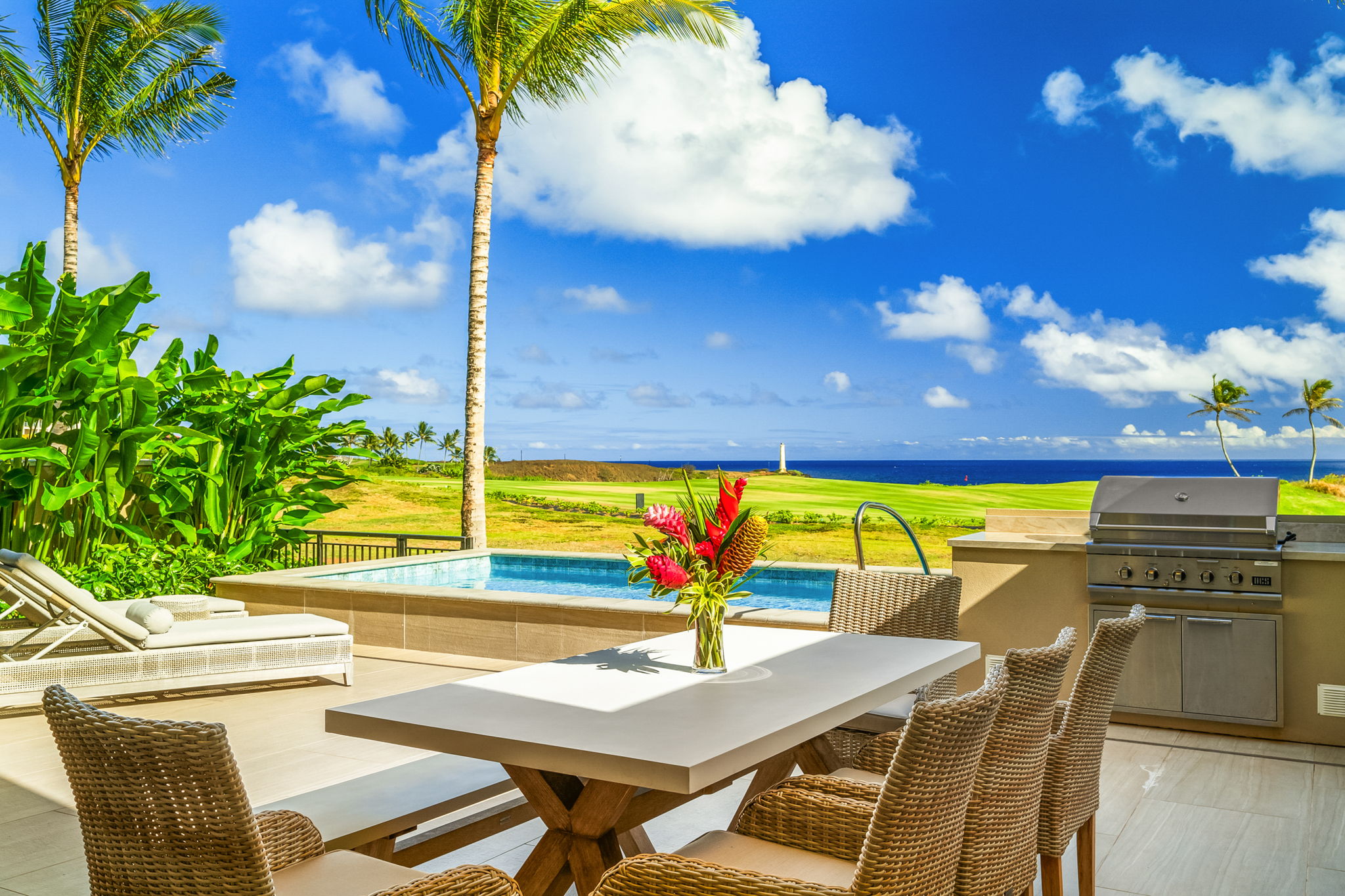 a view of a swimming pool with a table and chairs