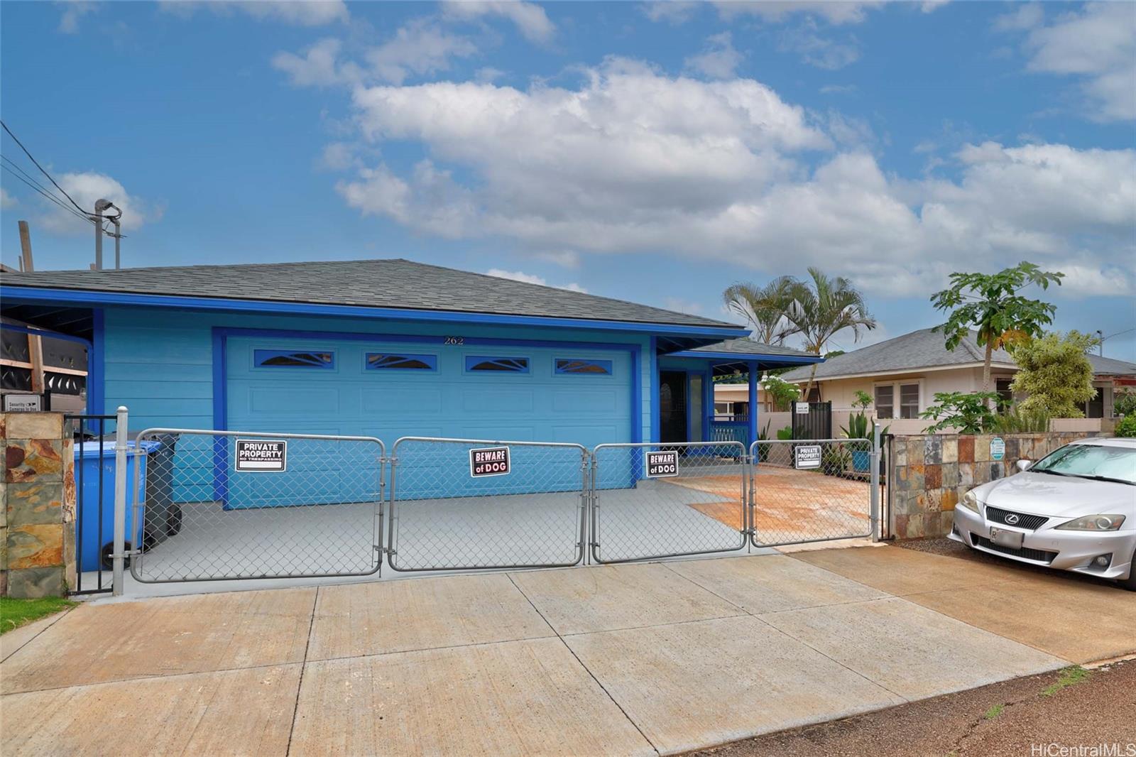 a view of a car park in front of house