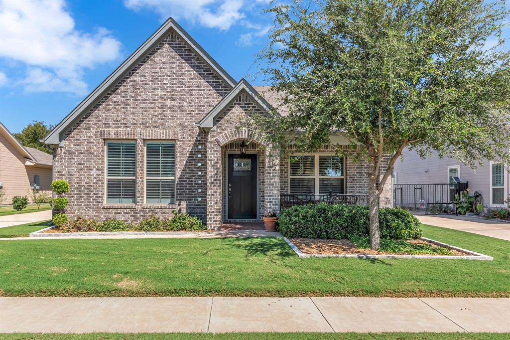 front view of a house with a yard