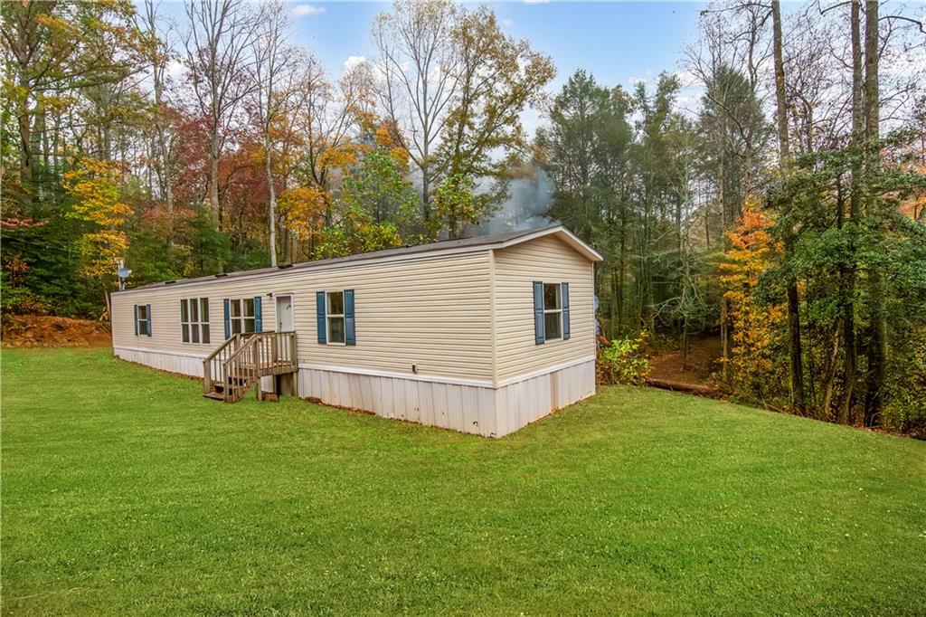 a view of a house with a yard