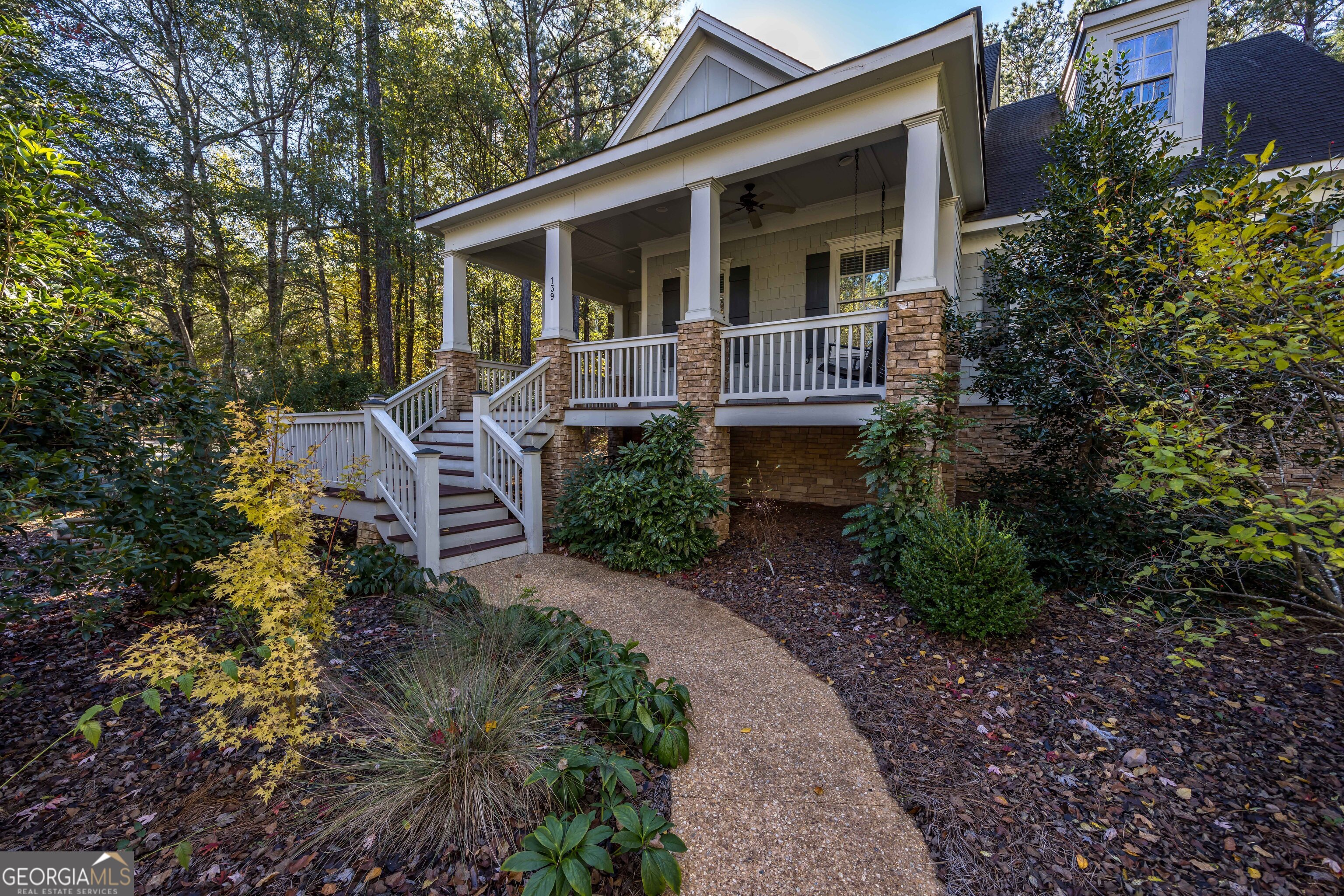 a front view of a house with garden