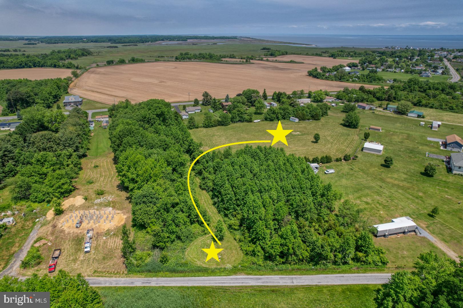 an aerial view of beach and yard