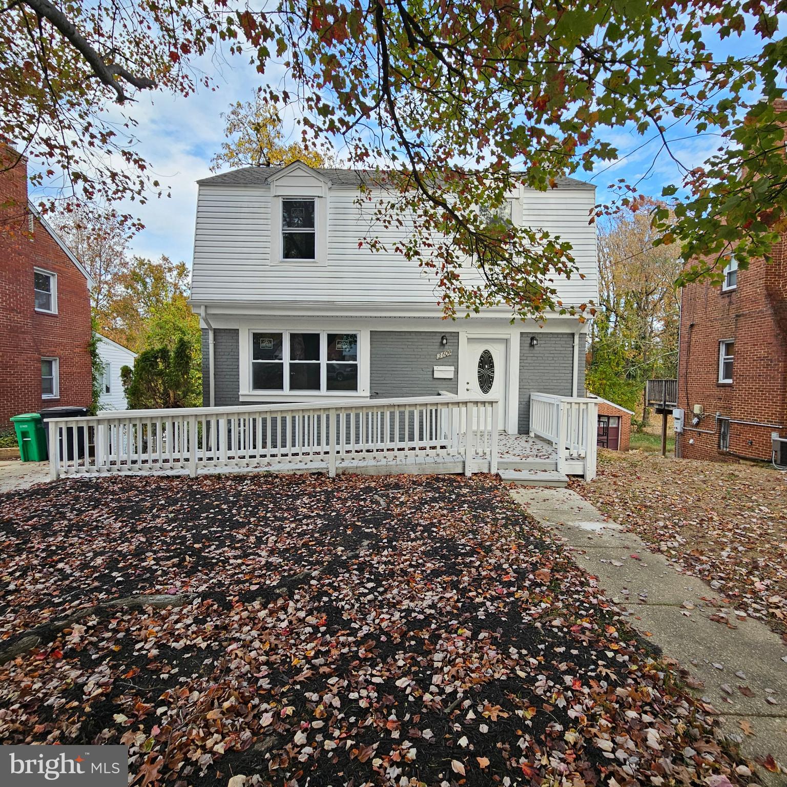 front view of a house with a small yard