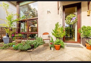 a garden filled with lots of potted plants