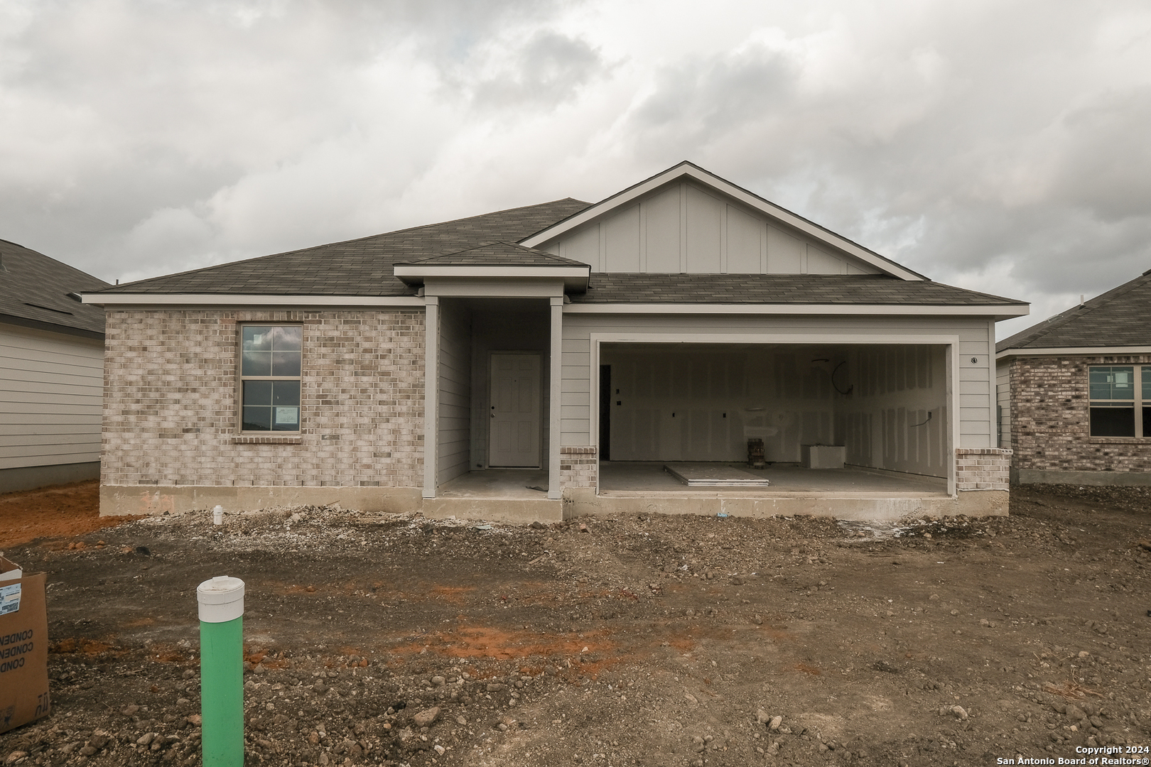 a front view of a house with yard