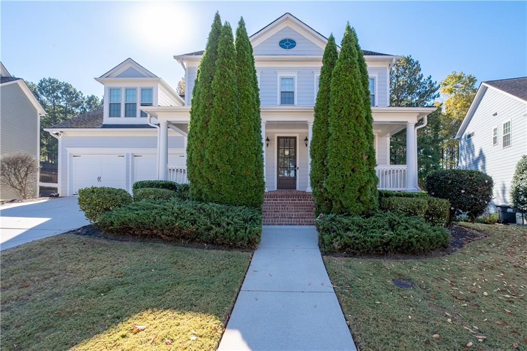 a front view of a house with a yard