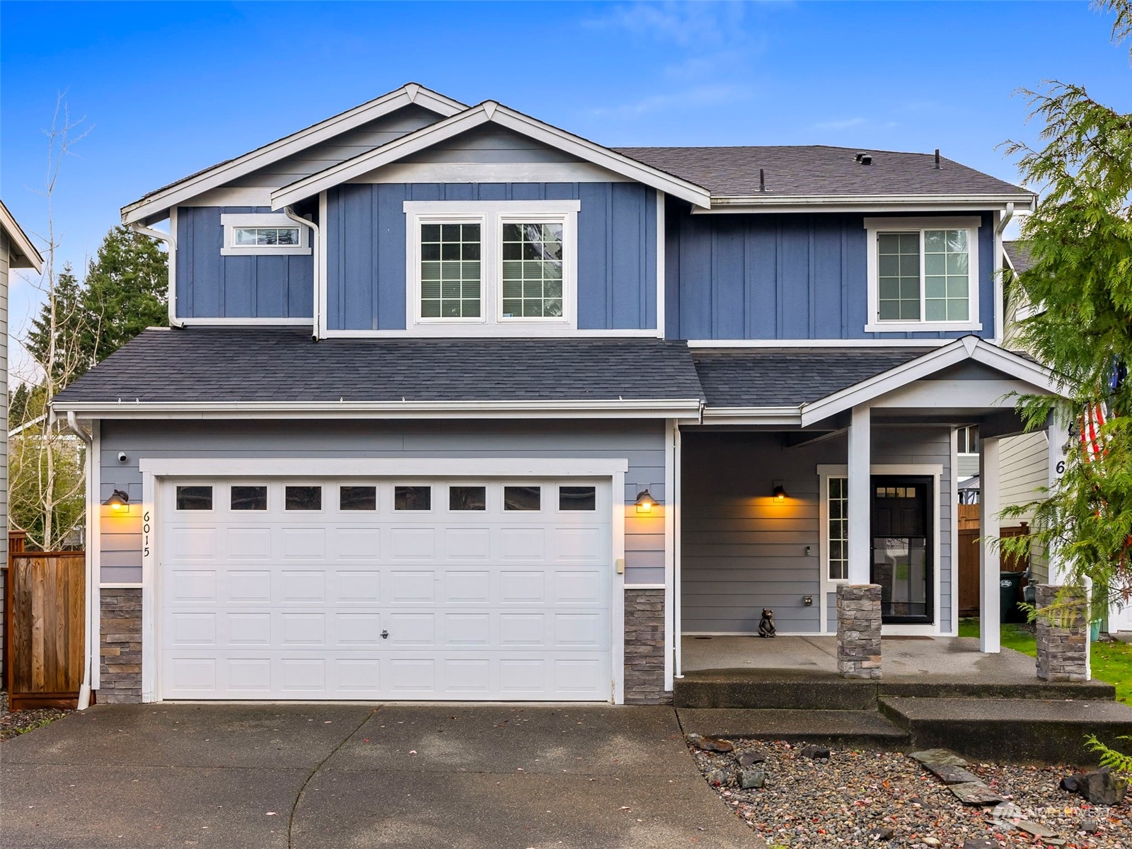 a front view of a house with a garage