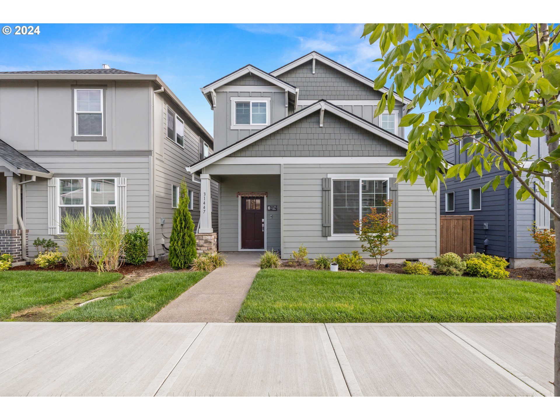 a front view of a house with a yard