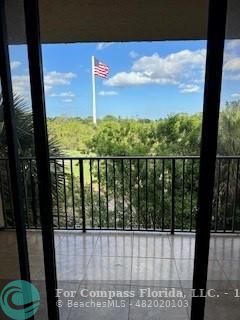 a view of a balcony with an ocean view