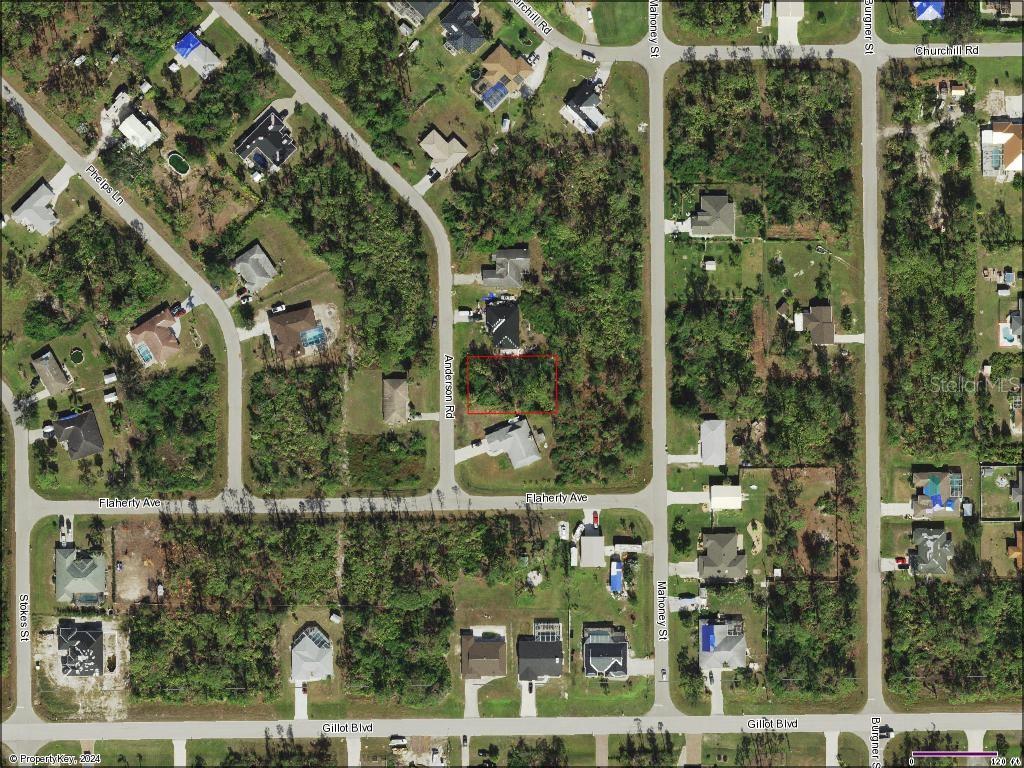 an aerial view of residential houses with outdoor space and street view