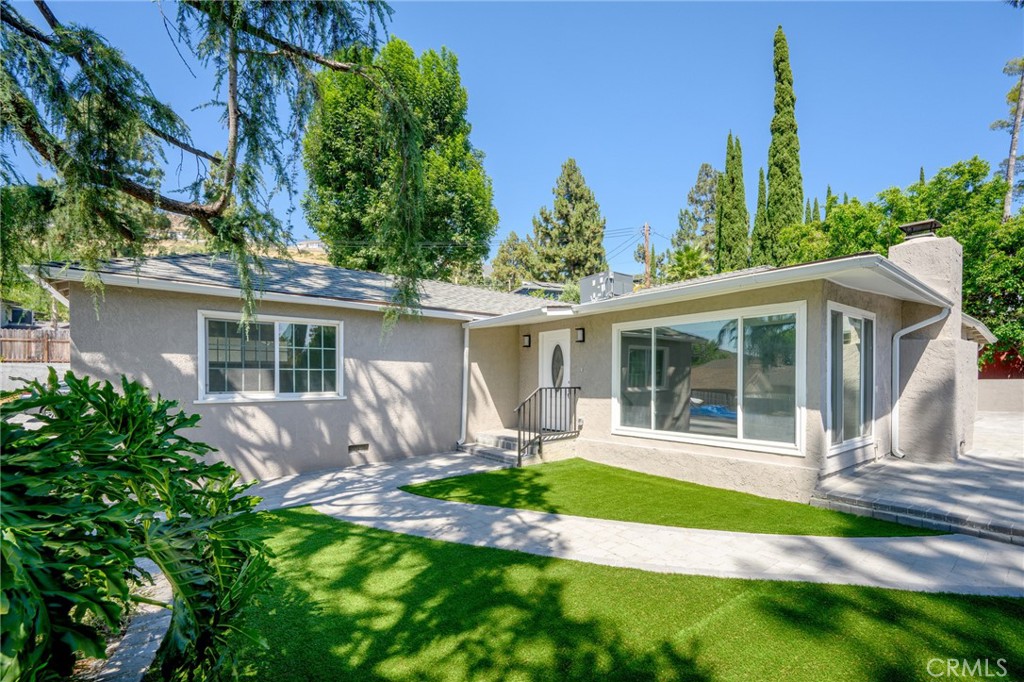 front view of a house with a yard