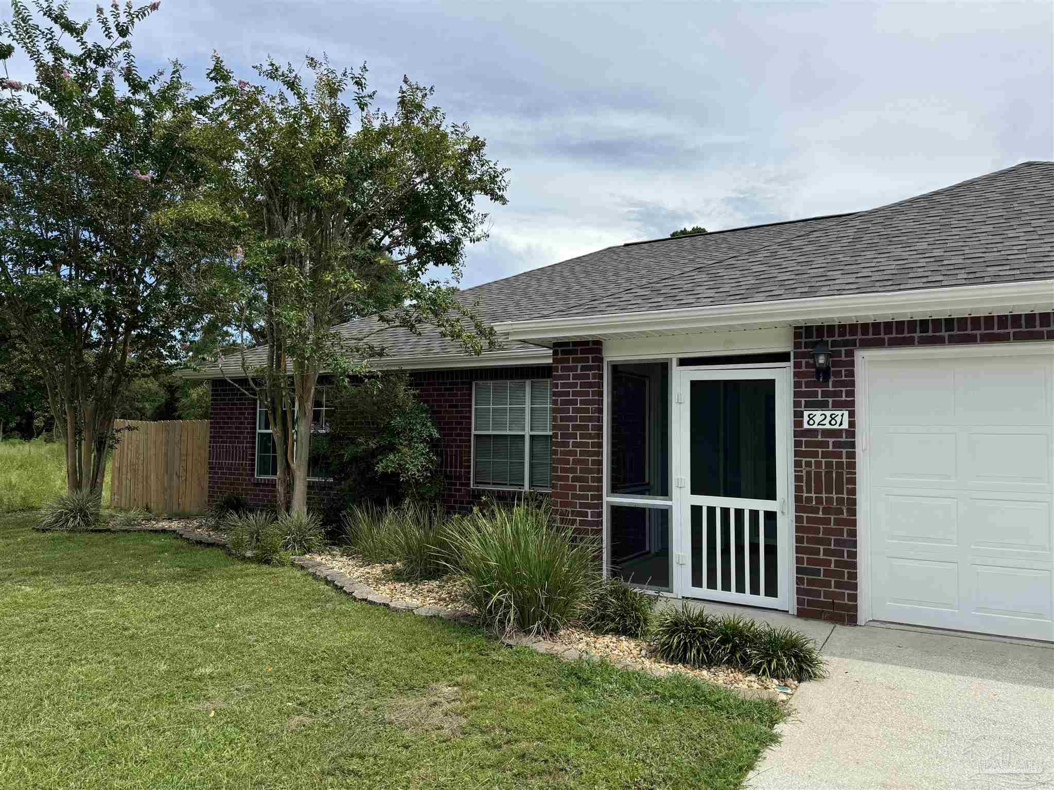 front view of a house with a yard