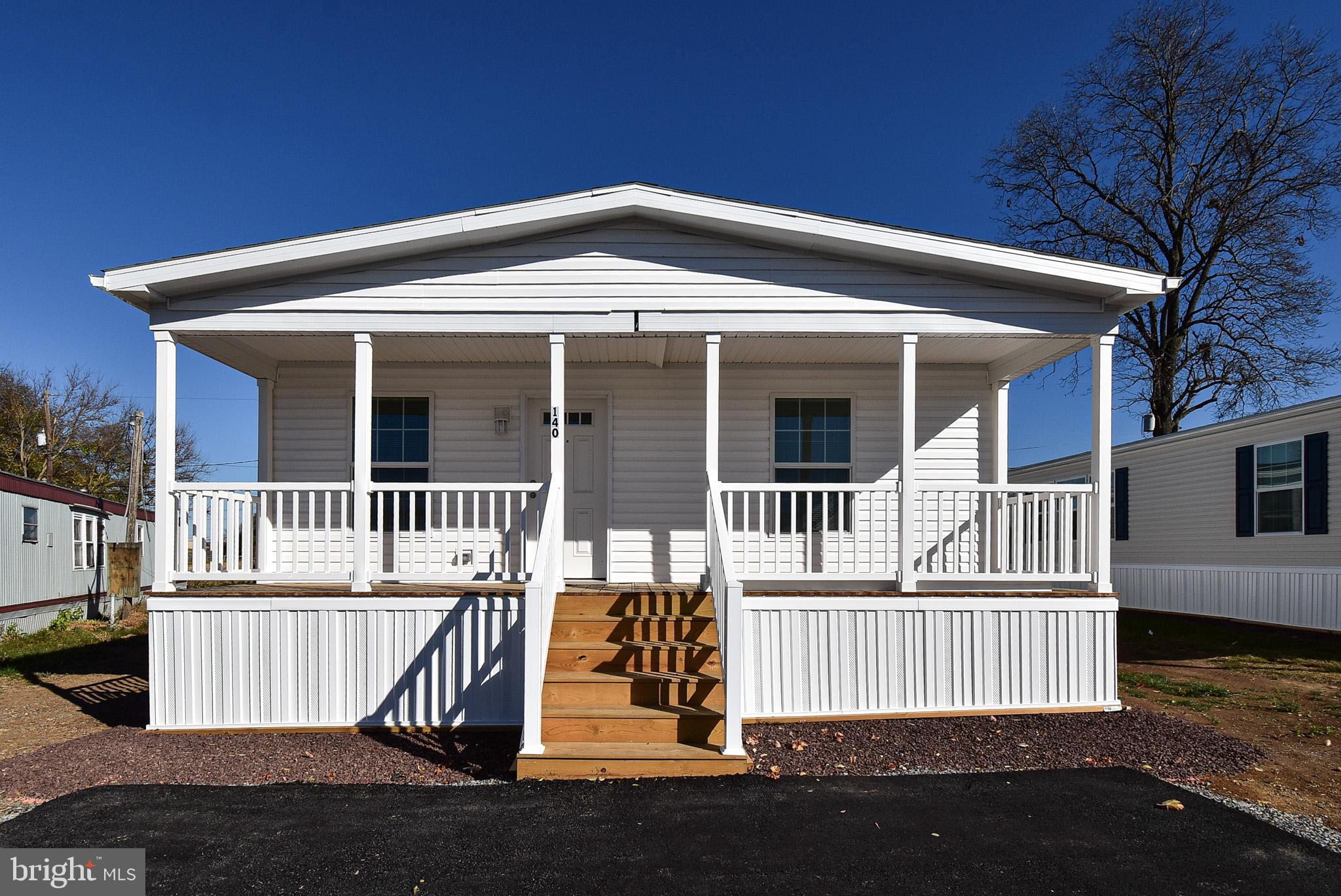 a front view of a house with a porch