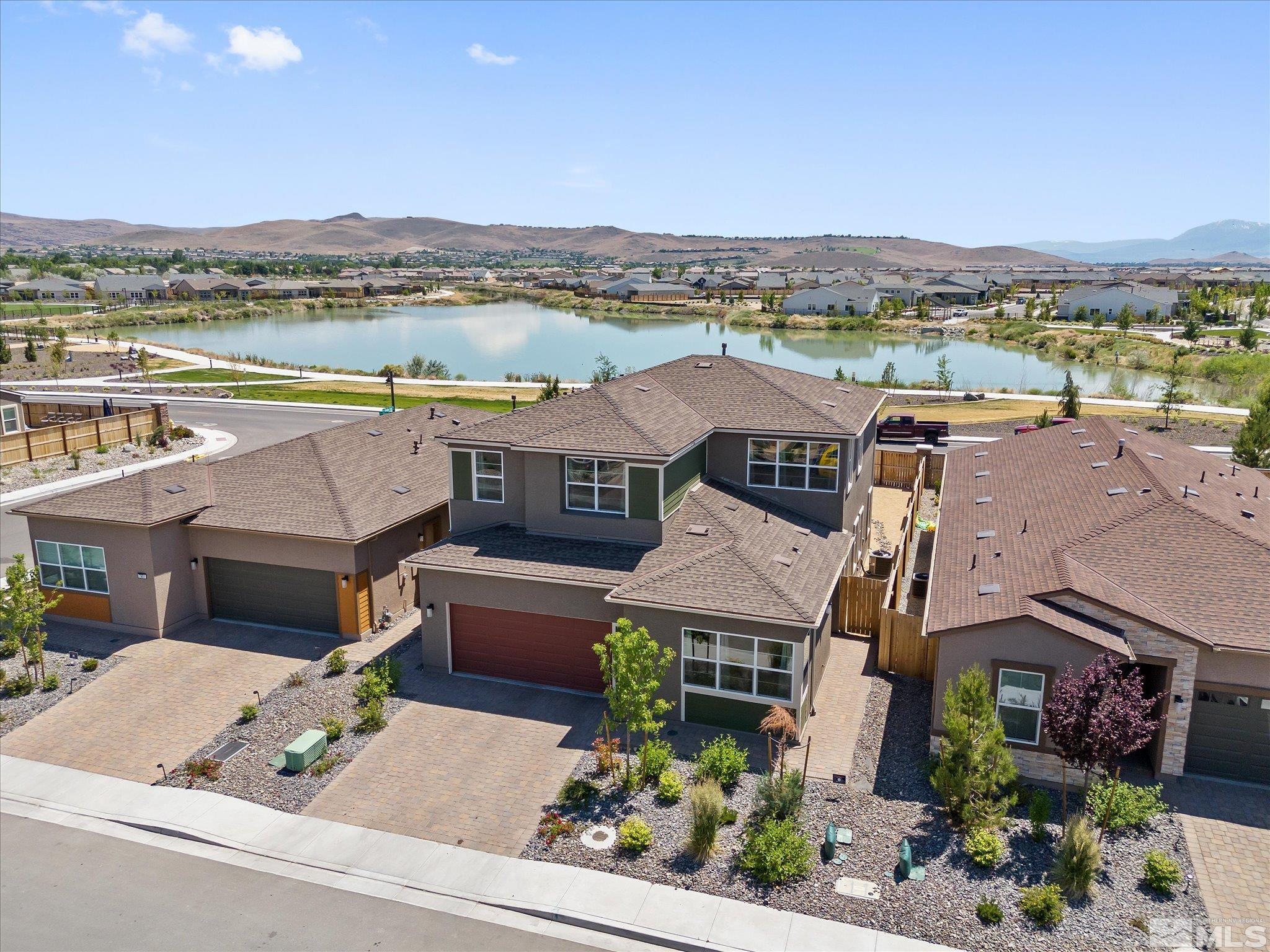 an aerial view of a house with a ocean view