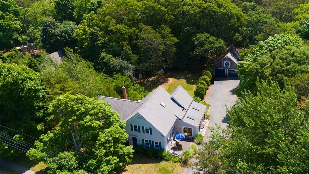 an aerial view of house with yard swimming pool and outdoor seating