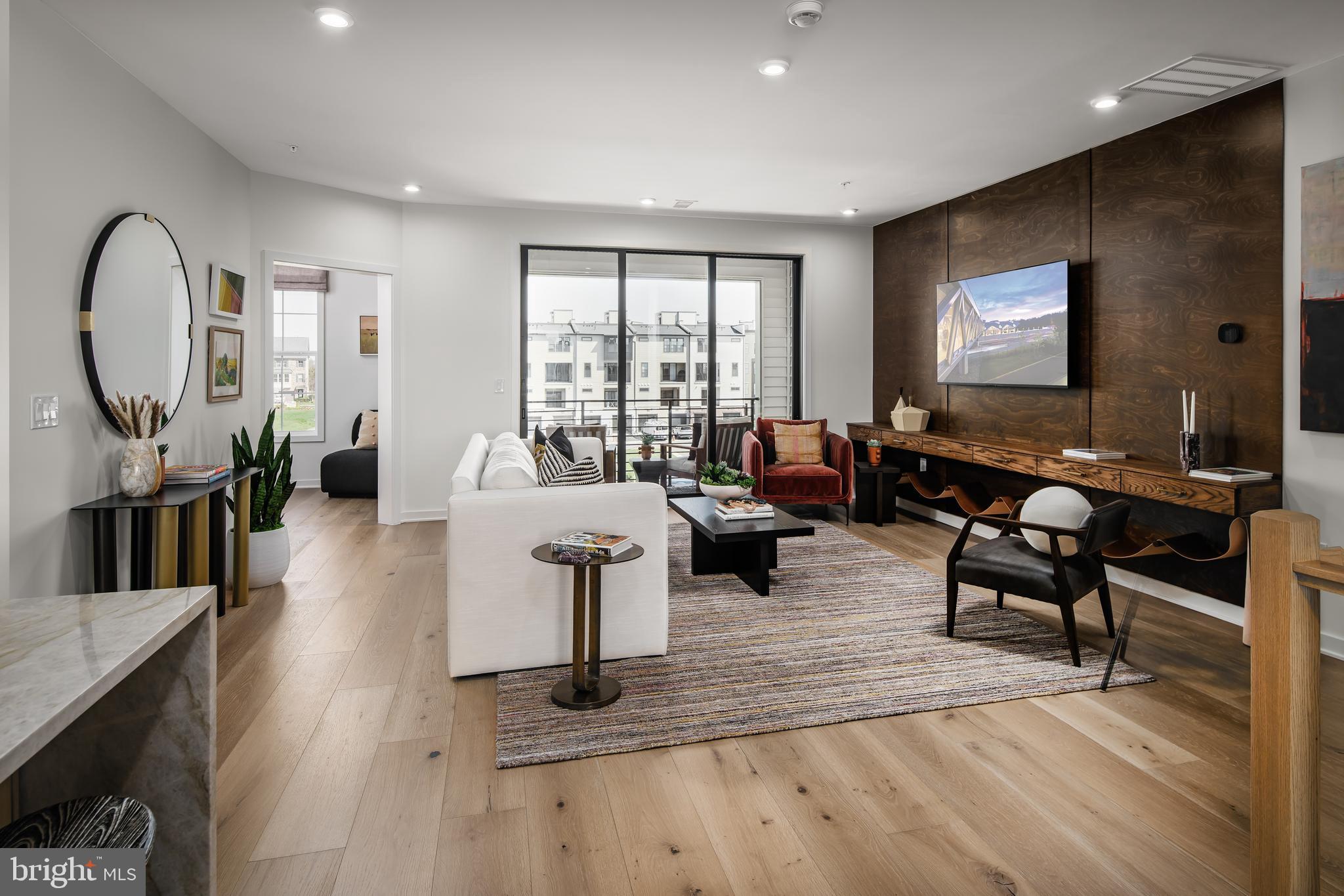 a living room with fireplace furniture and a flat screen tv