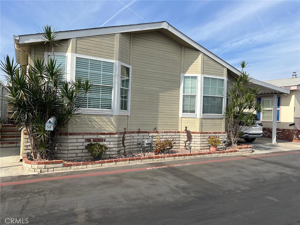 a front view of a house with a outdoor space