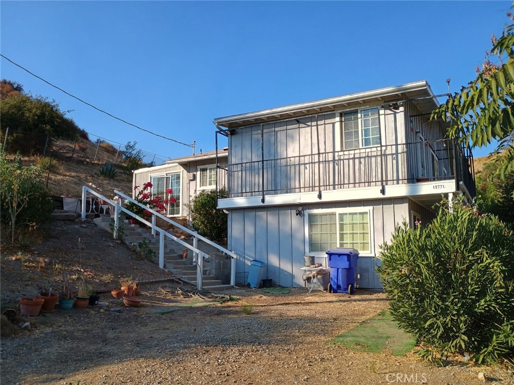 a view of house with yard