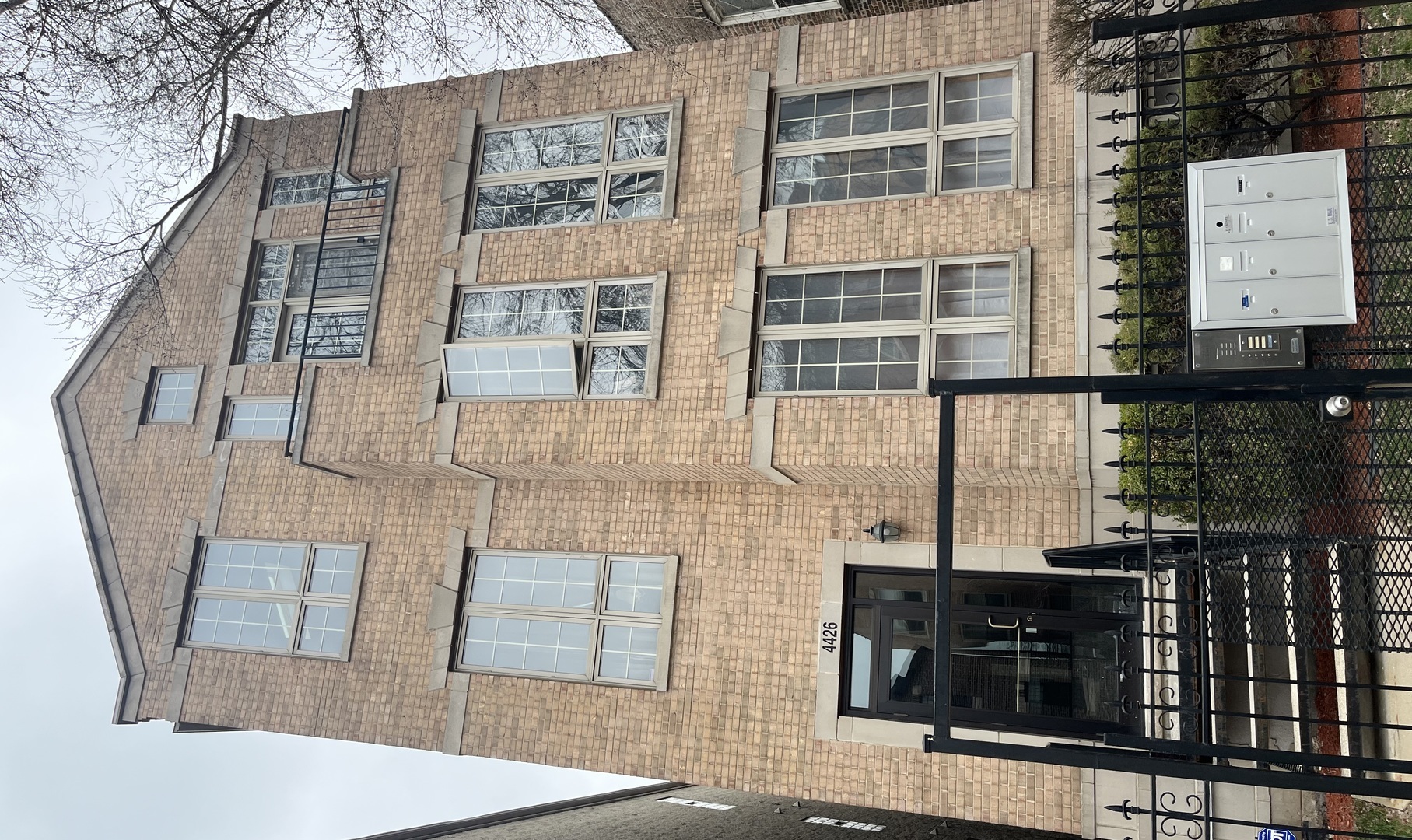 a front view of a building with glass windows