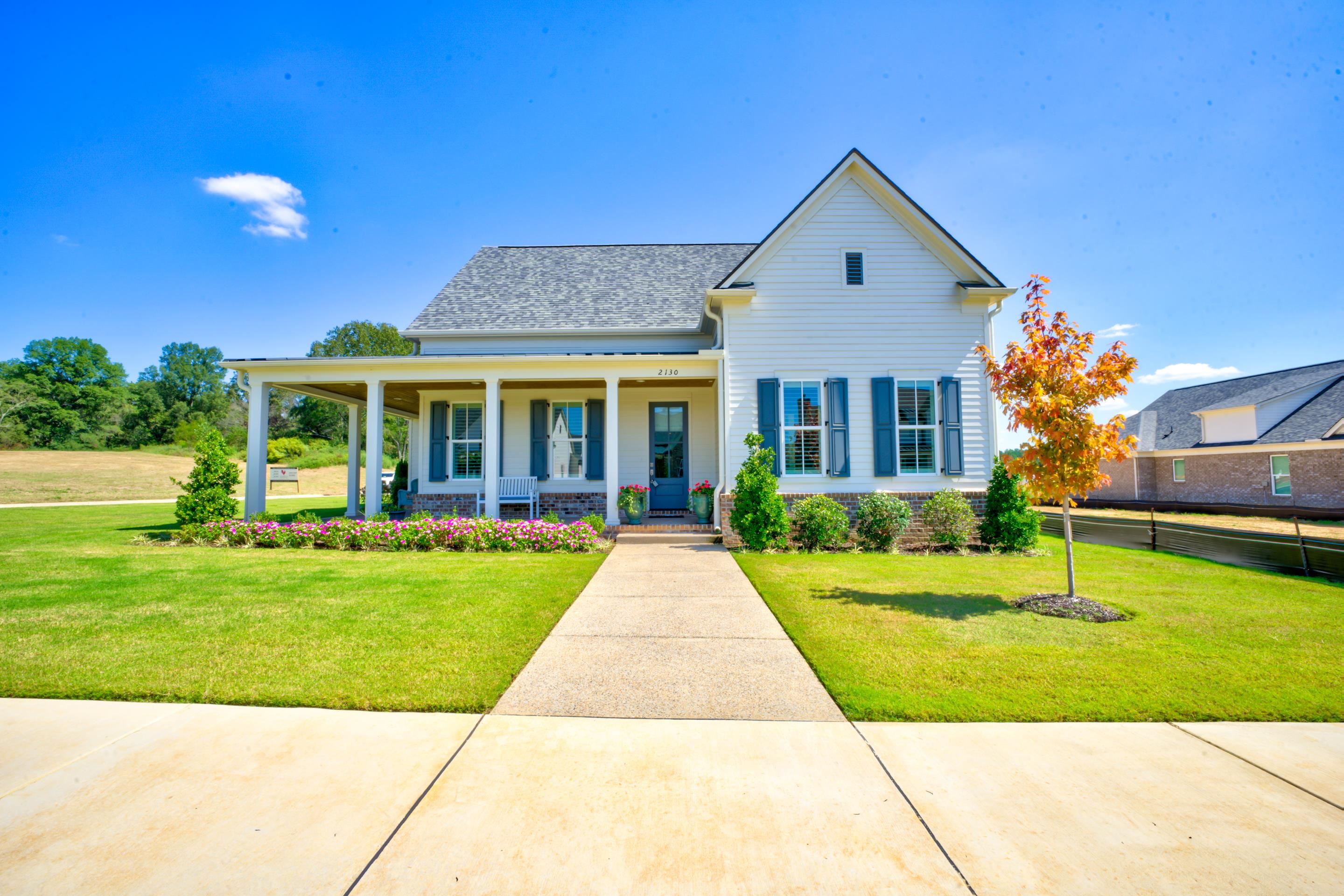 a front view of a house with a yard