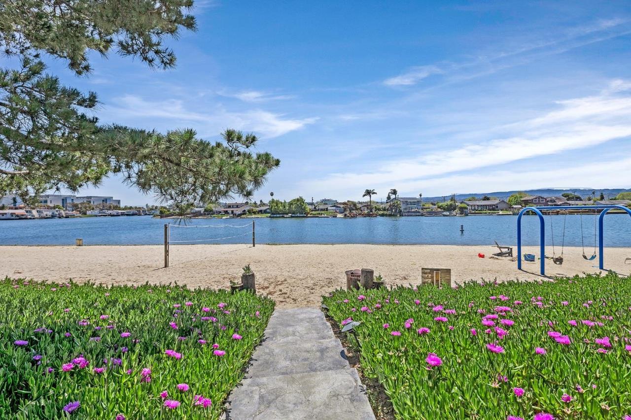 a view of a lake with a garden