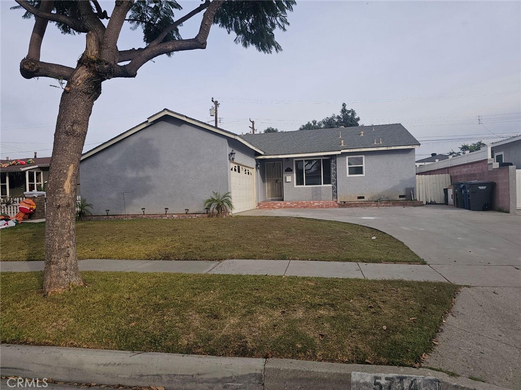 a house with trees in the background