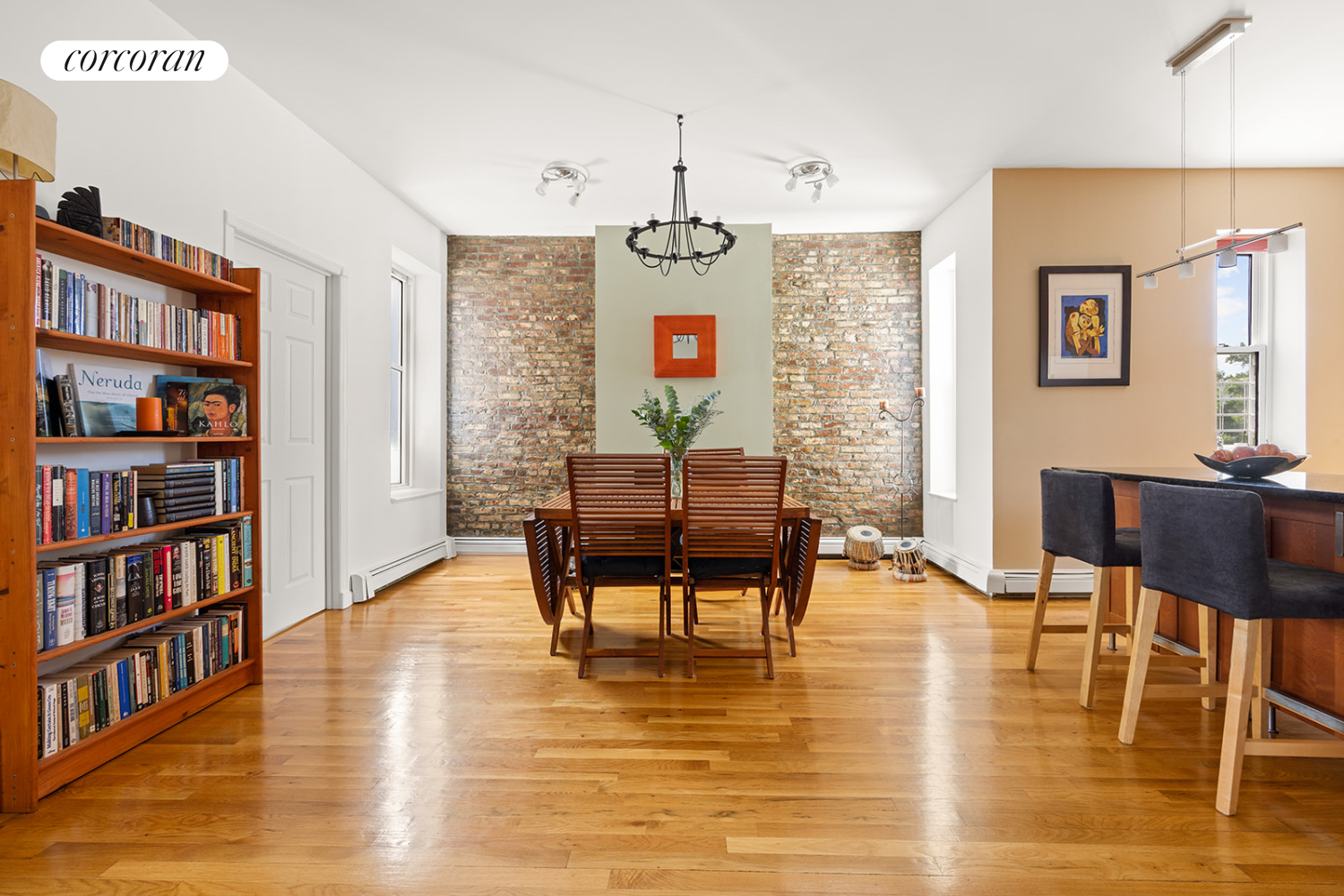 a living room with fireplace furniture and a book shelf