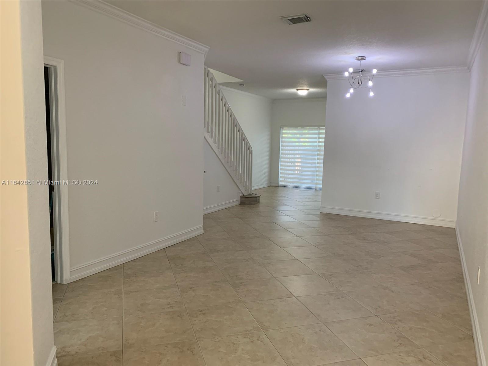 a view of an empty room with a bathroom