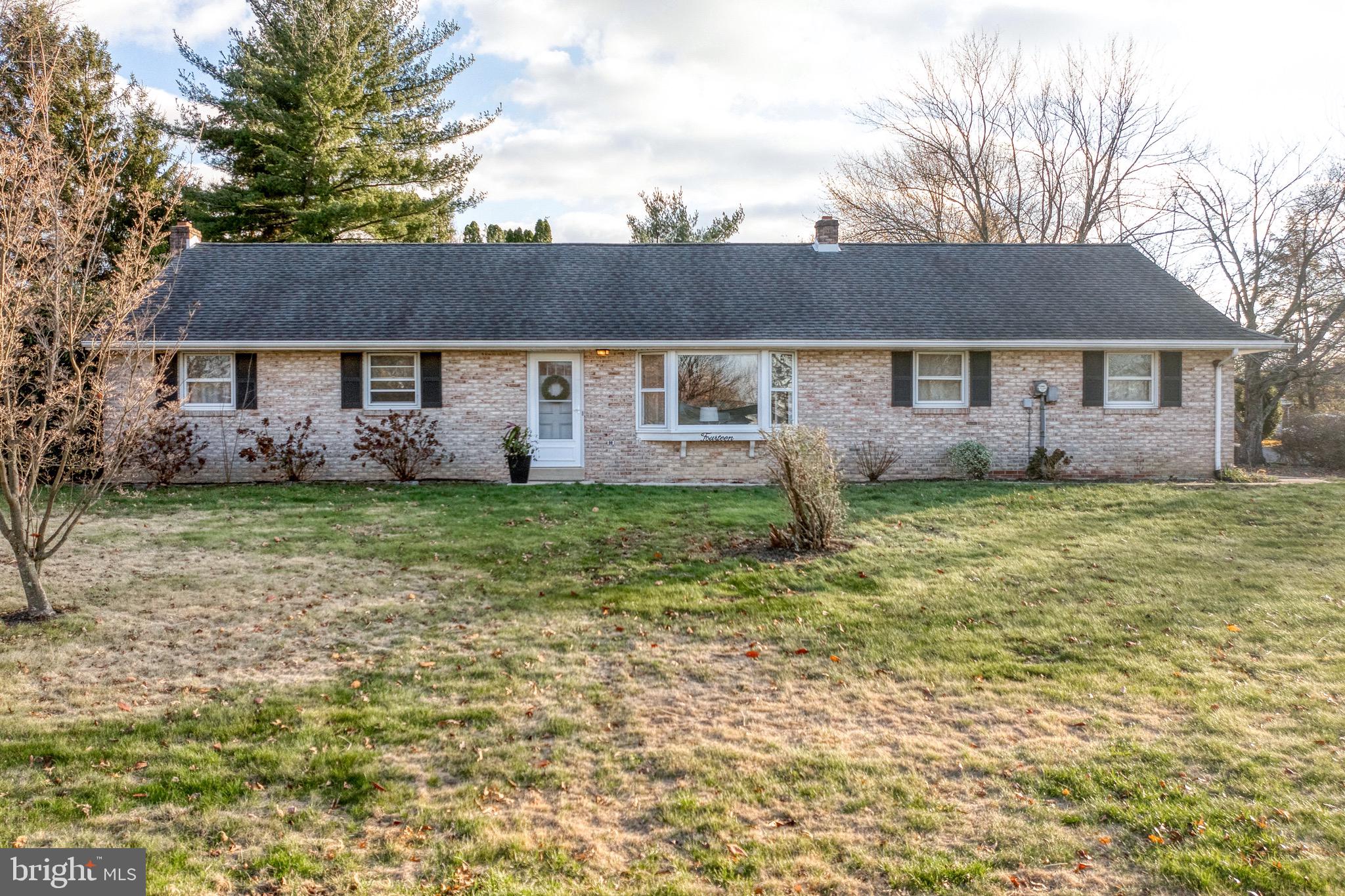 front view of a house with a yard