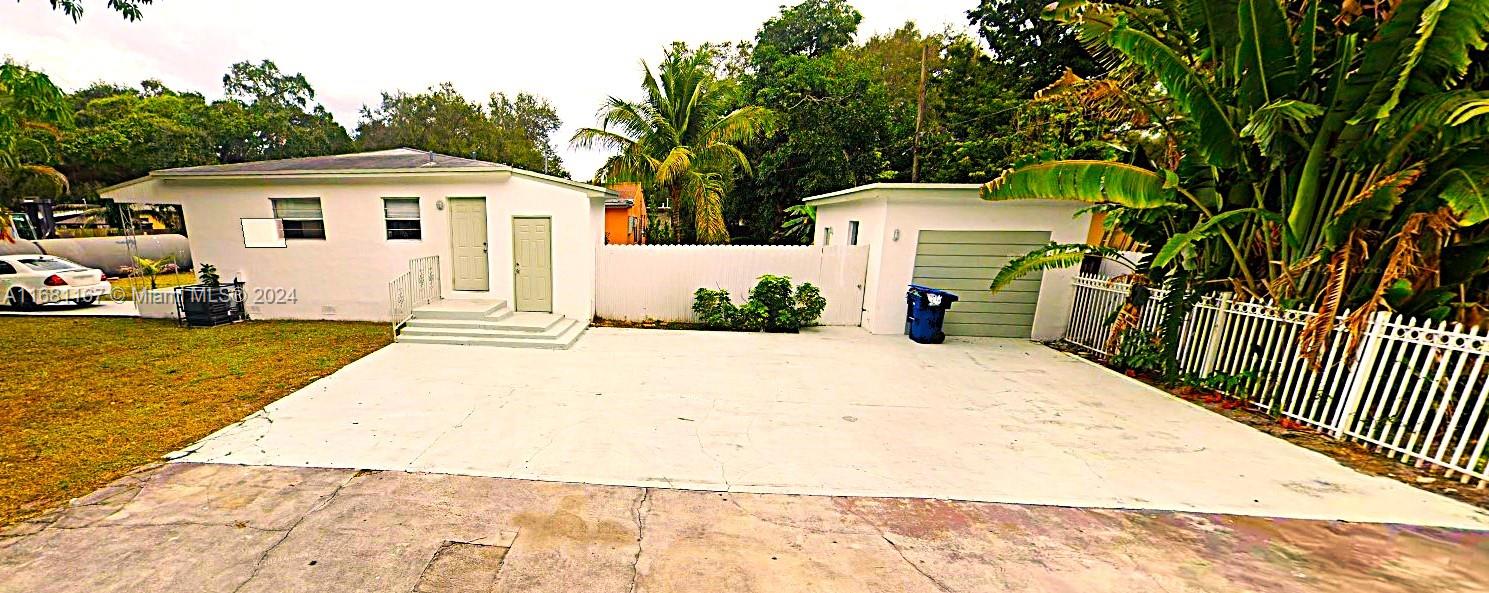 a view of garage and deck