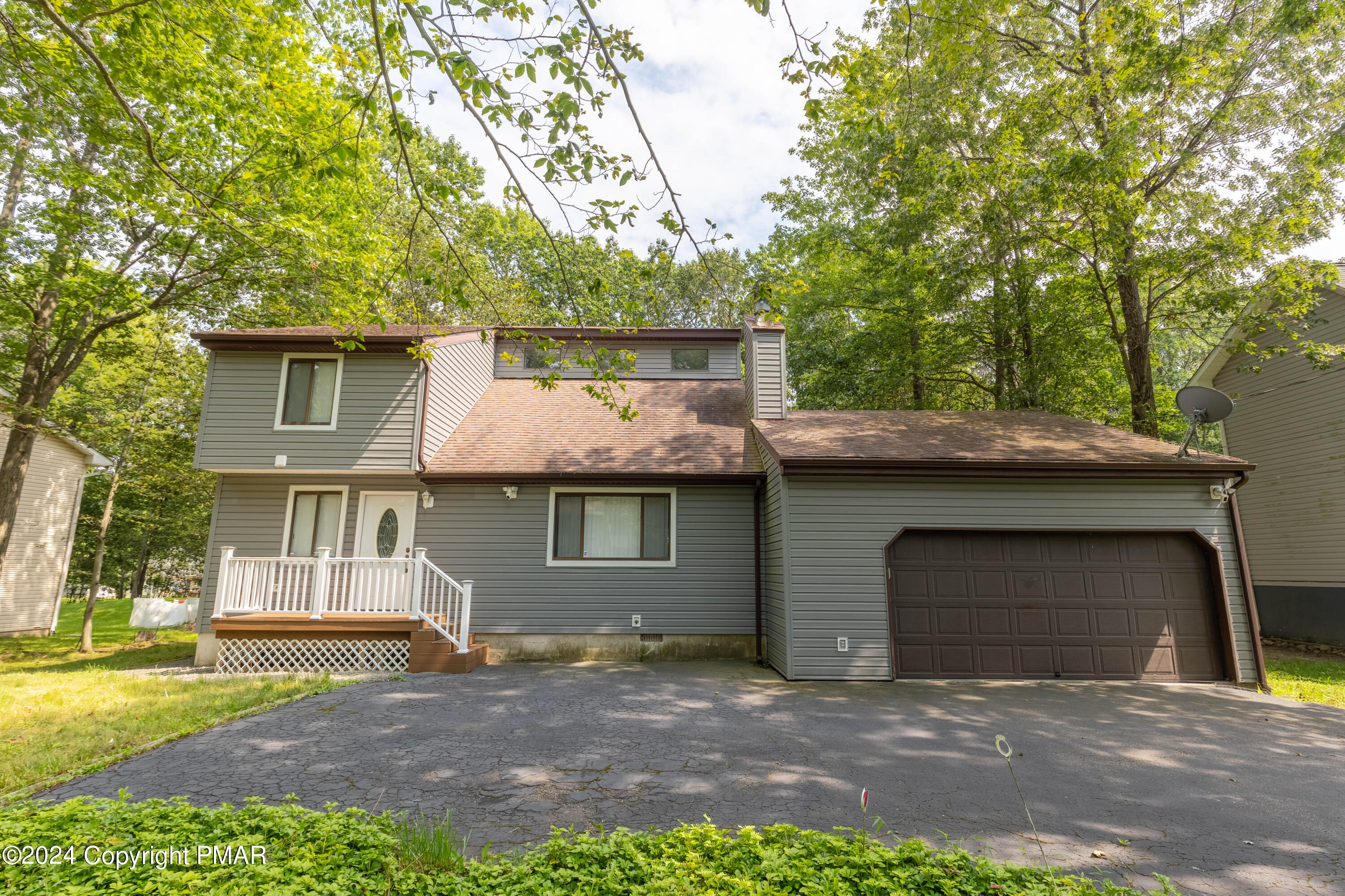 a front view of a house with a garage