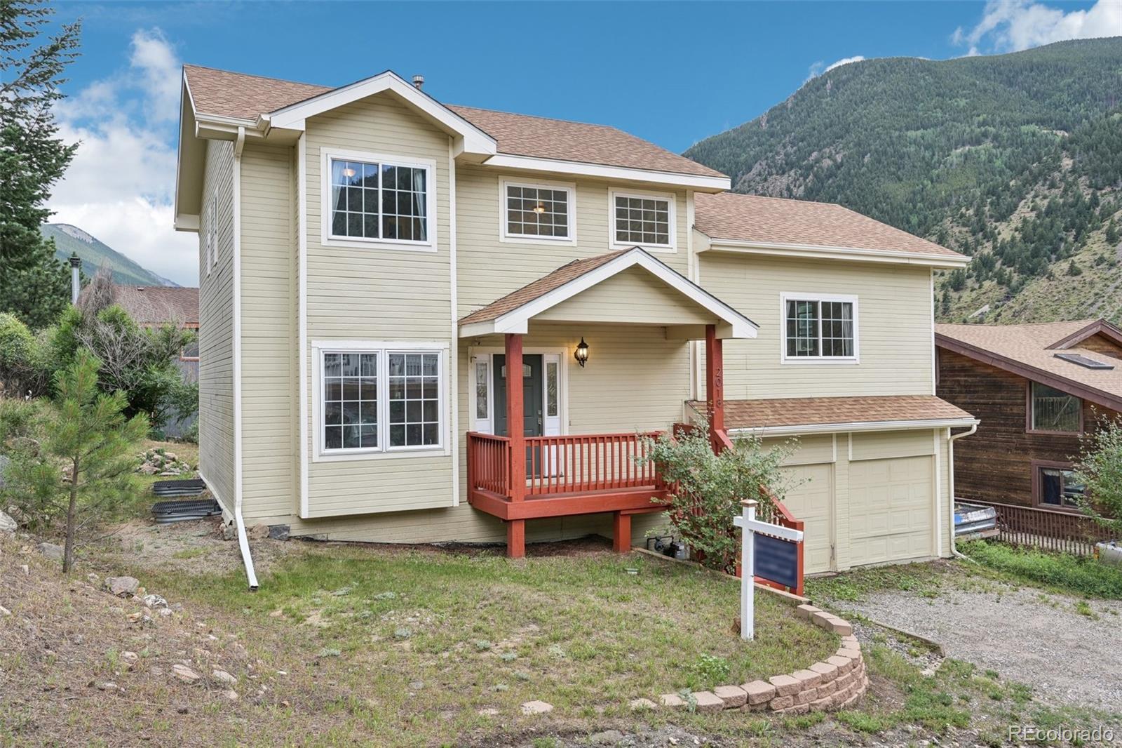 a front view of a house with a yard