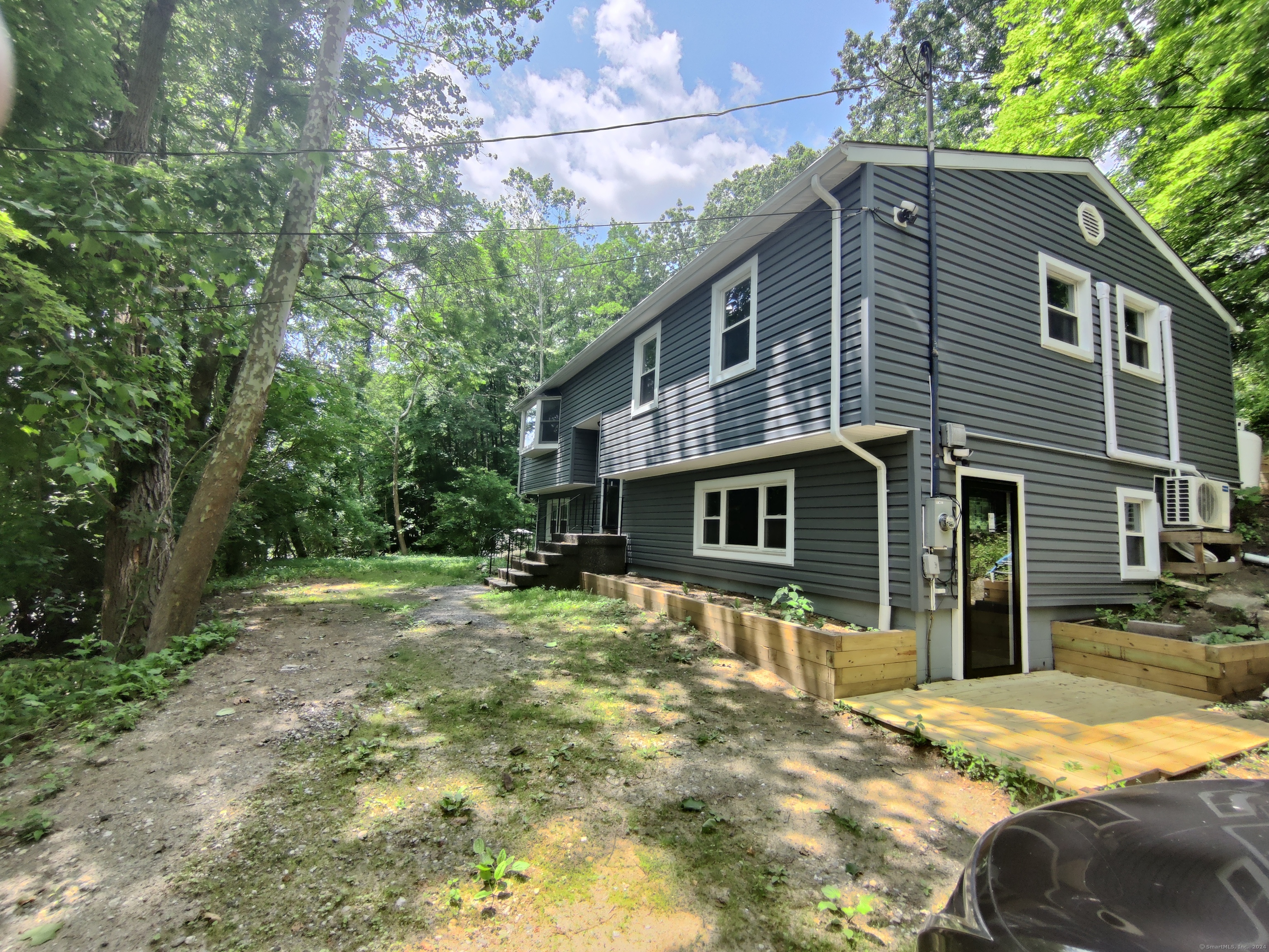 a front view of a house with a yard outdoor seating and yard