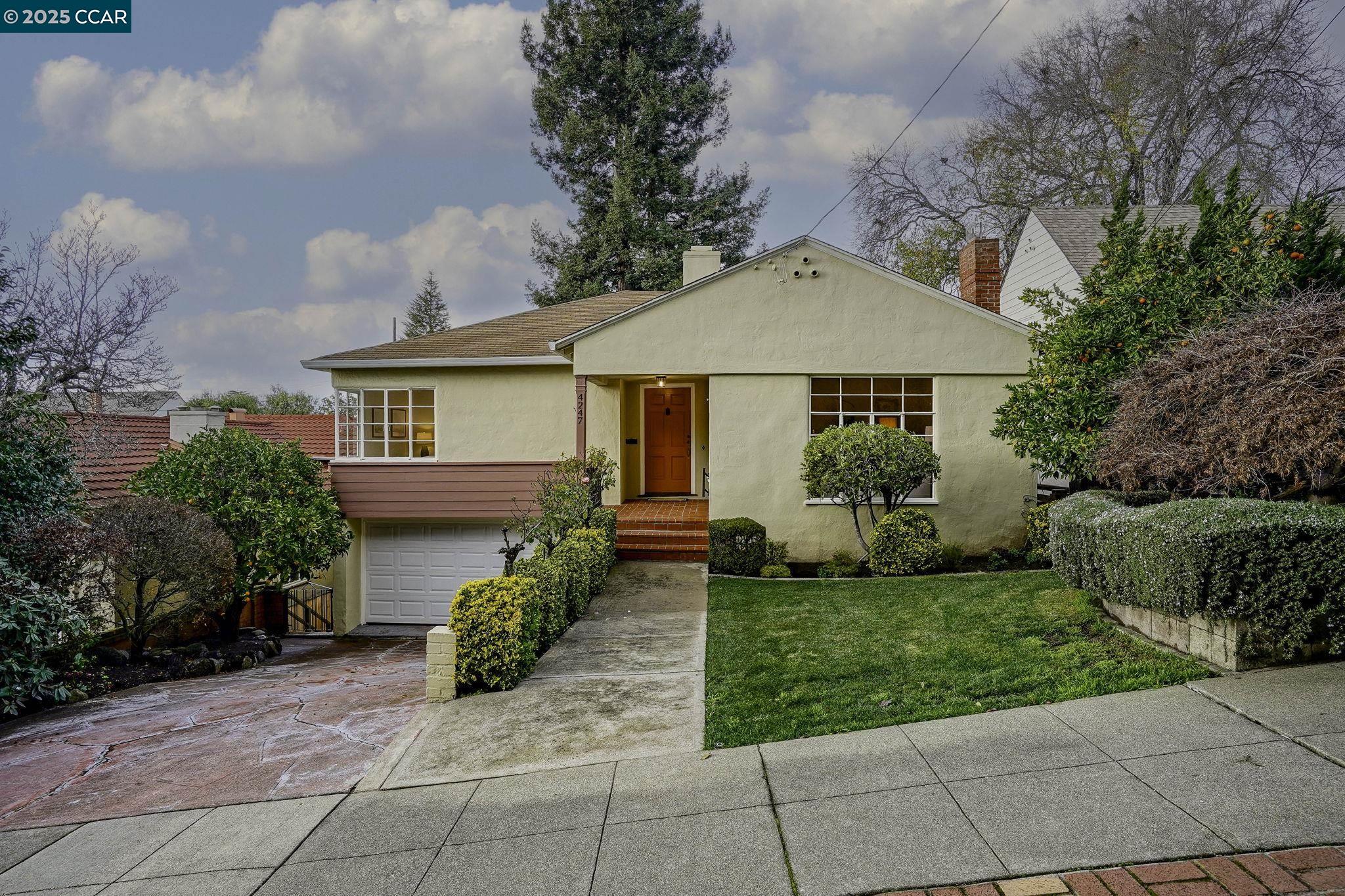 a front view of a house with garden