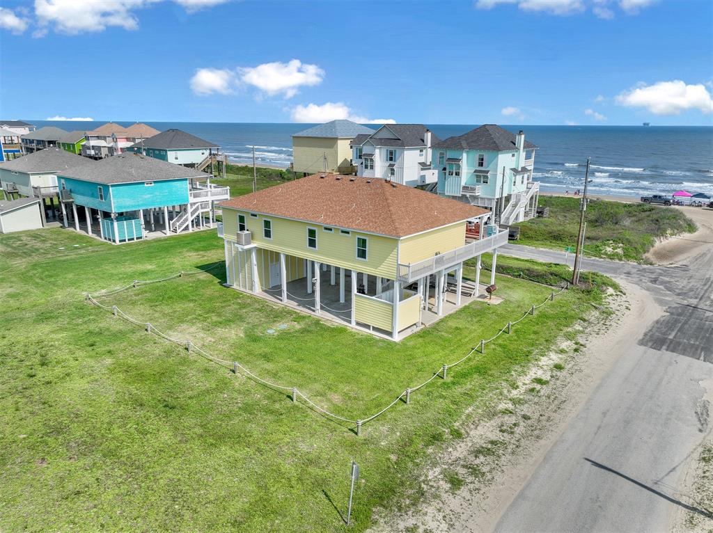 a aerial view of a house with a big yard