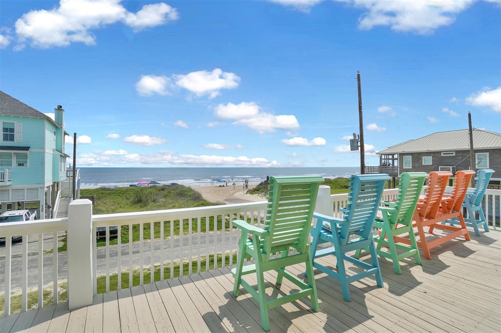 a view of a balcony with chairs