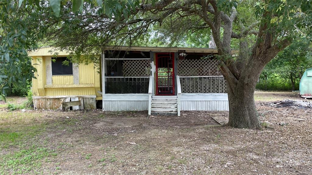 a house with trees in the background