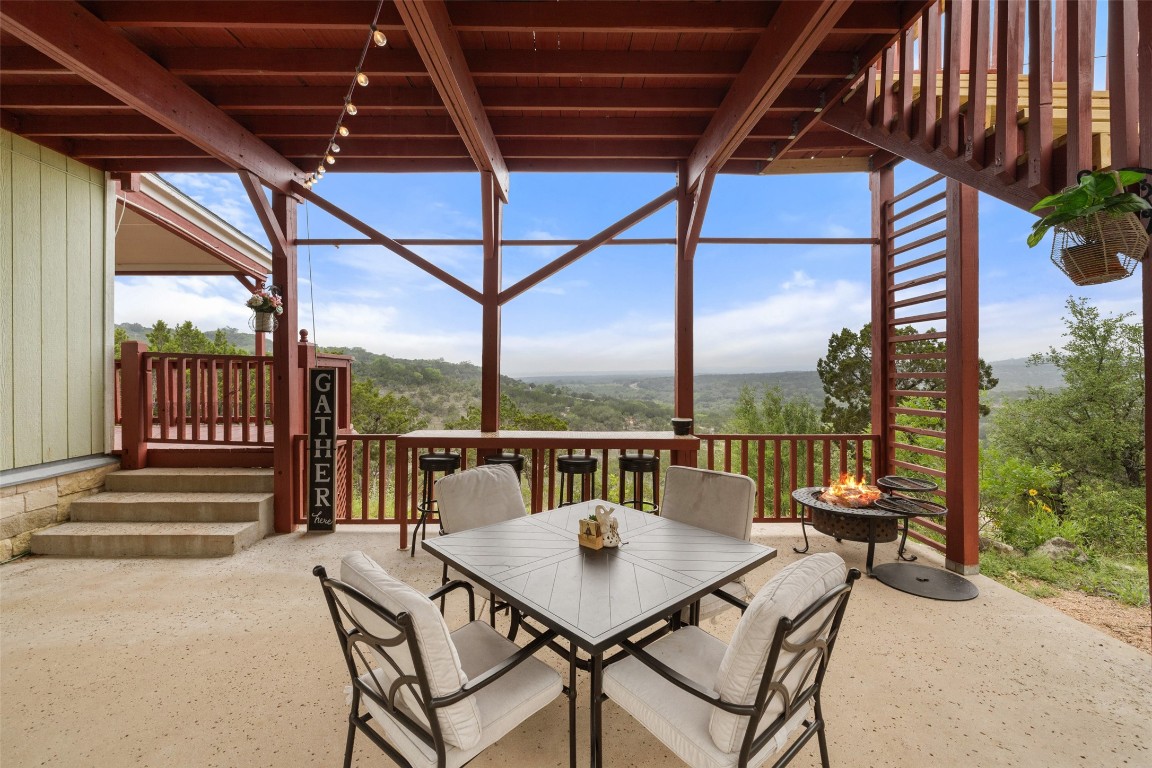 a view of a chairs and table in the patio