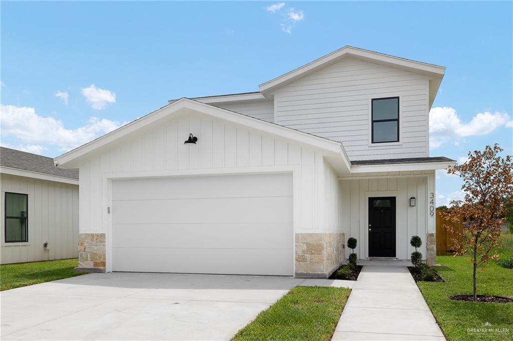 View of front of home featuring a garage